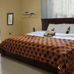 Sankofa guest house accra ghana hotel airbnb deluxe bedroom landscape 01