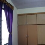 Sankofa guest house hotel airbnb deluxe ensuite ground king bedroom with wall shelves